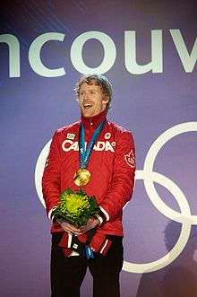 A man celebrating victory in a competition.