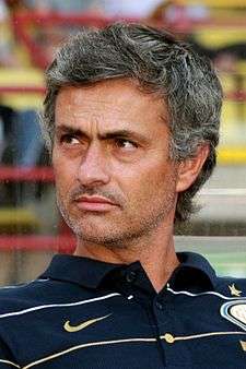 José Mourinho wearing a dark blue polo shirt with Inter Milan's badge