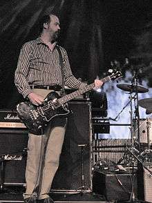 Novoselic playing bass guitar onstage