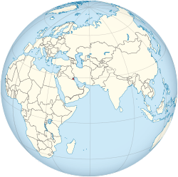 Location of  Kuwait  (red)in the Arabian Peninsula  (light yellow)