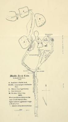 Hand-drawn map of a cave, showing meandering underground river passage as well as surface topography including large shakeholes.