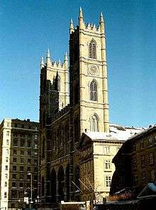 Notre-Dame Basilica, with two steeples, against blue sky