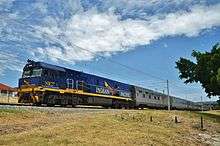 NR27 with an eastbound Indian Pacific in suburban Perth, 2013.