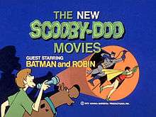 The title card has the show title at the top and Shaggy, holding a flashlight, and Scooby-Doo in the lower left. To the right, in the light from the flashlight, is shown Batman and Robin.