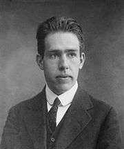 Head and shoulders of young man in a suit and tie