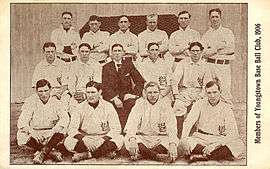 Group of 15 men standing in three rows.