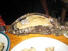 A 2-ft-long open oyster on plate