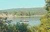 A canoe on a lake surrounded by forest