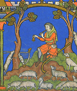 A painting showing a man in orange clothes playing a pipe and ringing a small bell. He is surrounded by numerous small white sheep, and two trees sit on either side of him. A small village is depicted in the upper left hand corner.