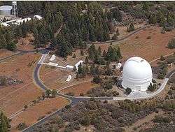 PTI is located atop Palomar Mountain, next to the large white dome of the historic 200" Hale Telescope