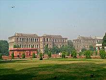 Contemporary photo of fort exterior, showing later British buildings