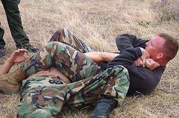 Staff Sgt. Roark demonstrates armbar