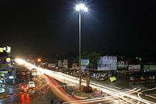 Highway at night, with billboards