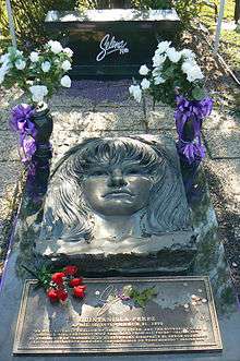 Elaborate grave marker with flowers