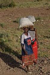 Shaba Kenya women carrying sacks.jpg