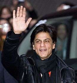 Shah Rukh Khan is seen waving at a crowd