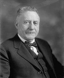 Upper-body portrait of an early-twentieth-century man in a suit.