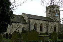 Stone church with castellated tower