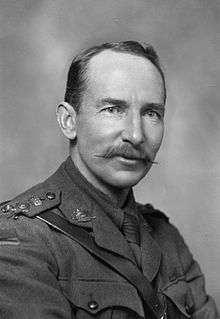 black and white portrait of a male in uniform