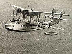 Supermarine Stranraer in flight over water