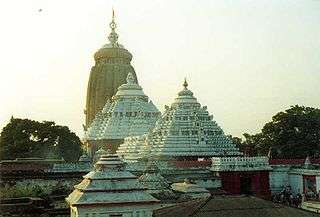 temple complex with four different towers, with the tallest in the background