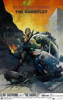 Official poster with artwork shows cartooned Clint Eastwood with ripped off shirt and jeans ,holding his gun and hugging Locke ,behind them there is a burnt ruined helicopter on the ground and a building. Below of the duo ,there is the film's title ,credits and release date and above the film's slogan.