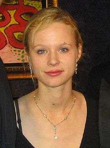 Young blonde woman wearing a necklace