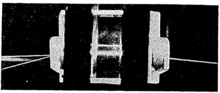 Two Prism Couplers with output beam (right) transferred via a guided wave and incident and reflected beams (left).