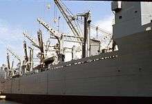 The side of a ship, as viewed from a dock