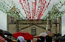 San Roque Church in barangay Mabolo with many parishioners attending a day mass.