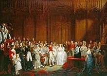 Painting of a lavish wedding attended by richly dressed people in a magnificent room