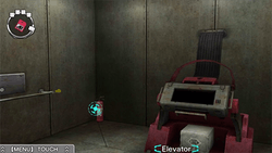 A screenshot of an Escape room. The room contains a metal contraption with a safe, while the game cursor hovers over a fire extinguisher.