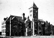 Early 20th century black-and-white photo of three-story building