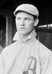 A man wearing a baseball uniform with an "A" on the chest.