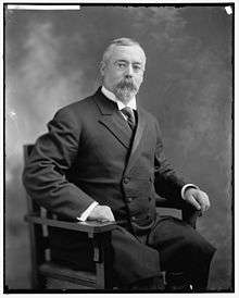 Upper-body portrait of an early-twentieth-century man in a suit.