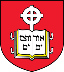 Crest of the school, containing a book device inscribed with Hebrew letters and cross in front of a red background