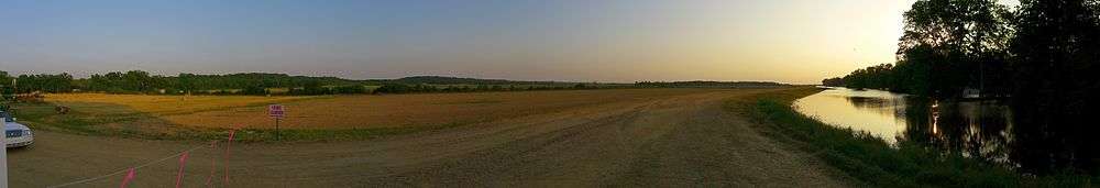 Looking west from Satartia. The Yazoo River has flooded the buildings to the right of the levee.