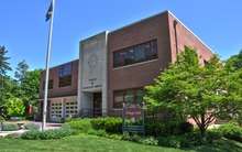 A two-story brick firehouse