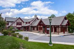 A single-story Tudor Revival-style library