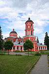 A red church with black roofs