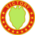 A hollow red circle with stars and the word "Victory", inside a green leaf