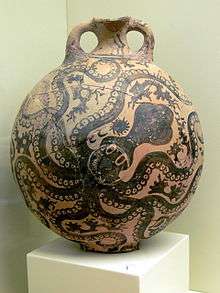 An ancient nearly spherical vase with 2 handles by the top, painted all over with an octopus decoration in black