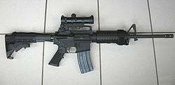 A Colt AR-15 Carbine with a Colt 4×20 scope.