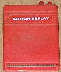 A large square software cartridge in a red case.