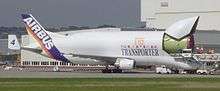 Outsized transport aircraft unloads an A320 fuselage part at Hamburg Finkenwerder Airport