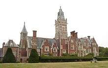 A photograph of a grand Victorian manor house