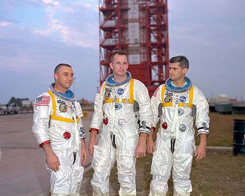 Grissom, White, and Chaffee in front of the launch pad containing their AS-204 space vehicle