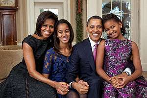 The Obamas embracing and smiling