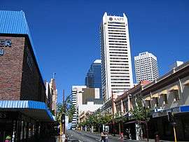 Photograph of road and city buildings