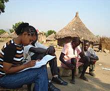 Ethiopian Chemical Engineer Firehiwot Mengesha, of Gaia Association speaks with Sudanese refugees in the Bonga refugee camp as part PGI's education program.